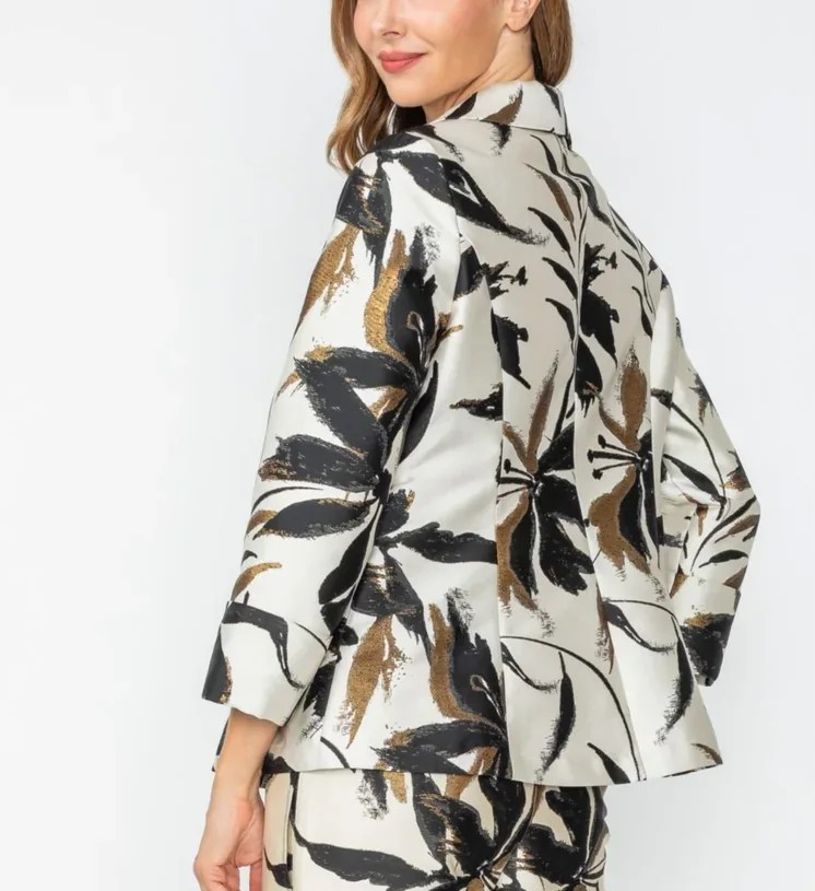 Woman wearing a floral patterned outfit on a white background